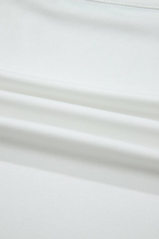Close-up of the white Prairie Lace Mesh Top fabric, showing soft folds and texture.