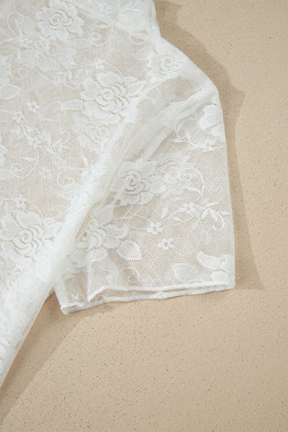 Close-up of a white Prairie Lace Mesh Top, showcasing the delicate floral lace pattern on the fabric.