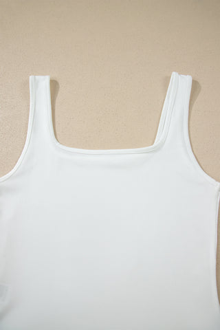 A white Prairie Lace Mesh Top with a square neckline, laid flat against a light brown textured background.