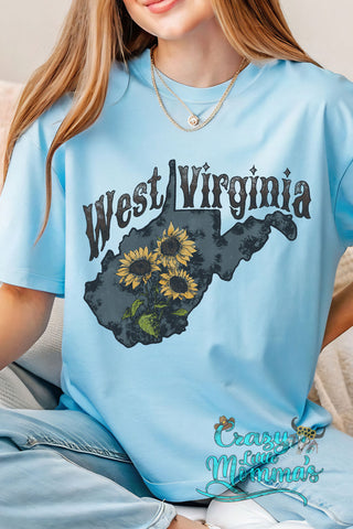 Light blue tee with "West Virginia" text above a state outline filled with sunflowers.