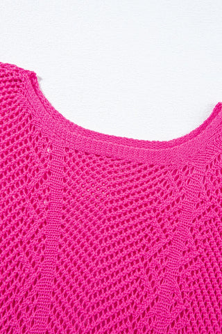 Close-up of a bright pink Trailblazer Knit Top with a boho chevron knit pattern and a wide neckline.