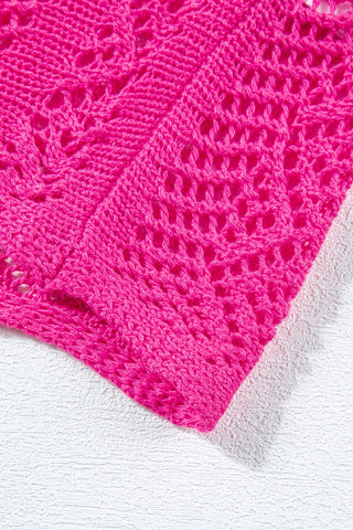Close-up of a vibrant pink Boho Chevron Knit Top with intricate open-knit patterns and a textured hem.