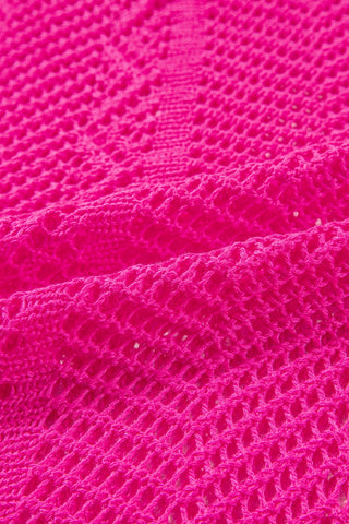 Close-up of the vibrant pink Trailblazer Knit Top, showcasing its intricate open-knit texture and chevron pattern.