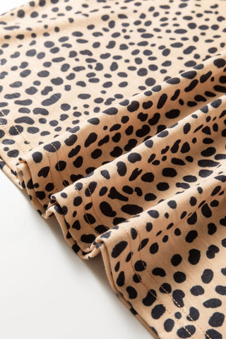 Close-up of the Untamed Beauty Top, showing the tan fabric with black cheetah print and ruffled details.