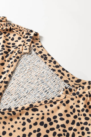 Close-up of the Untamed Beauty Top, showing the cheetah print fabric and smocked bodice detail.