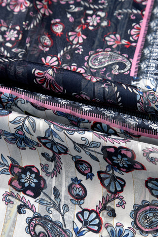 Close-up of the Wanderlust Patchwork Kimono fabric, showing blue, pink, and white floral and paisley patterns.