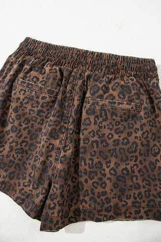 Back view of a Wildcat Drawstring Skort, featuring a brown and black leopard print, elastic waistband, and pockets.