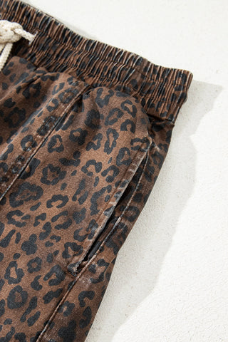 Close-up of the Wildcat Drawstring Skort, showing the brown leopard print fabric, elastic waistband, and side pocket.