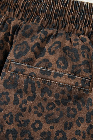 Close-up of the Wildcat Drawstring Skort, showing the brown and black leopard print fabric and a back pocket.