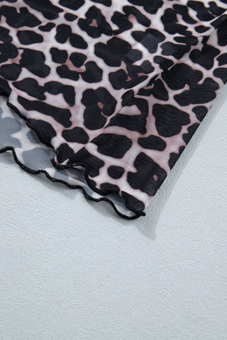 Close-up of a Wildcat Mesh Mock Top, showing the leopard print mesh fabric and ruffled hem.
