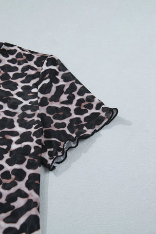 Close-up of a Wildcat Mesh Mock Top, showing the leopard print mesh fabric and ruffled short sleeve.