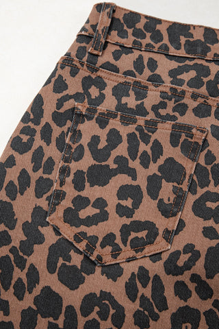 Close-up of the Wildcat Midi Denim Skirt, showing the leopard print denim fabric and a back pocket.