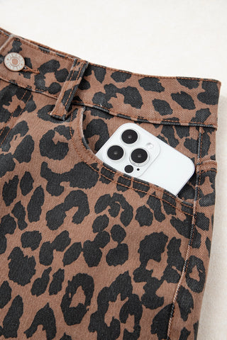Close-up of a Wildcat Midi Denim Skirt with a phone in the front pocket, showcasing the leopard print denim.