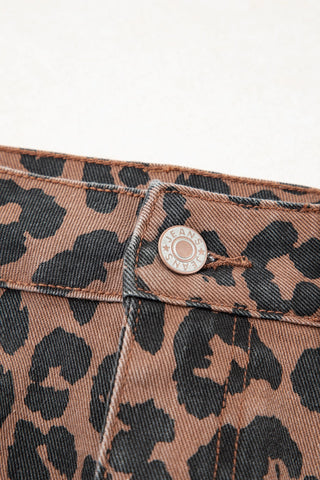 Close-up of a Wildcat Midi Denim Skirt, showing the brown and black leopard print denim fabric and a "JEANS" button.