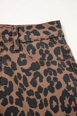 Close-up of a Wildcat Midi Denim Skirt, showing the brown and black leopard print denim fabric and front pocket.