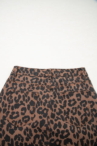 Back view of a Wildcat Midi Denim Skirt, featuring a brown and black leopard print with two back pockets.