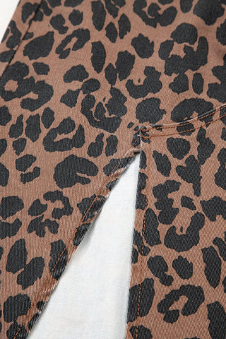 Close-up of a Wildcat Midi Denim Skirt, showing the brown and black leopard print denim fabric and a front slit.