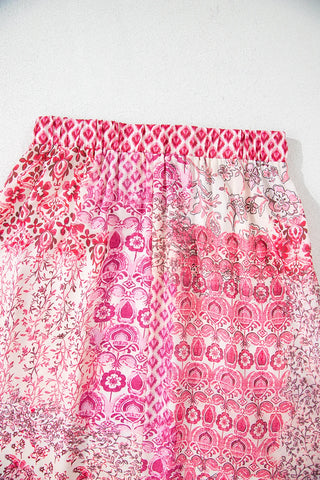 Close-up of a Wildflower Patchwork Maxi Skirt with various pink and white floral and geometric patterns.