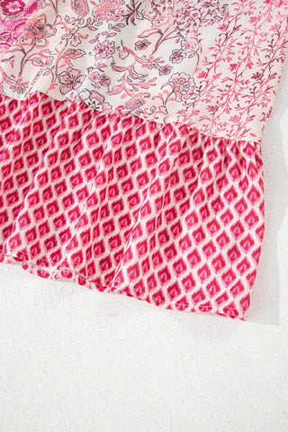 Close-up of a Wildflower Patchwork Maxi Skirt with pink floral and geometric patterns.