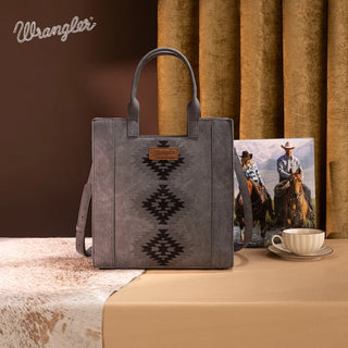 Gray Wrangler tote bag with black Aztec embroidery, a brown logo patch, and a shoulder strap.