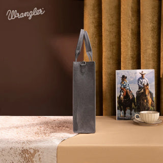 Gray Wrangler Aztec Embroidered Tote & Wallet Set standing upright on a table with a western-themed backdrop.