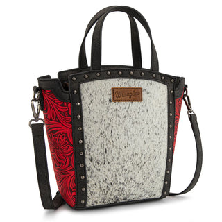 Wrangler red & black hair-on cowhide tote/crossbody with floral embossed sides, studded trim, and logo patch.