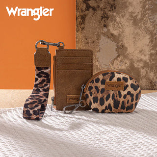 Wrangler brown leopard print card case, round coin purse, and wristlet keychain on a white textured surface.