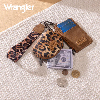 Wrangler leopard print coin purse and brown card case with blue cards, cash, and coins on a textured surface.