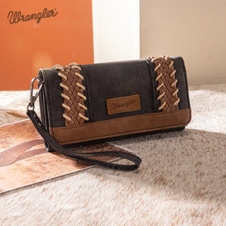 Wrangler Whipstitch Wallet in black and brown with braided accents and a wrist strap on a fur surface.
