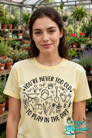 Dirt Play graphic tee on a corn silk shirt