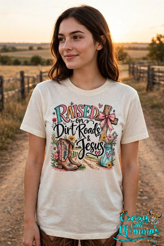 Dirt Roads and Jesus graphic tee on a natural shirt