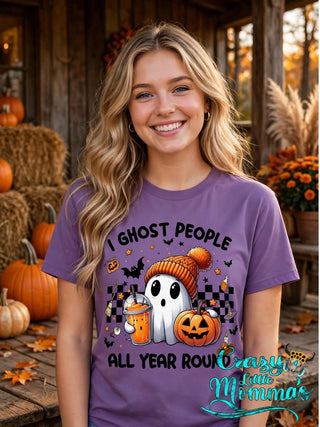 Ghost All Year graphic tee on a purple shirt