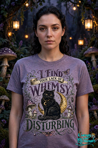 Whimsy is Disturbing graphic tee on a purple shirt